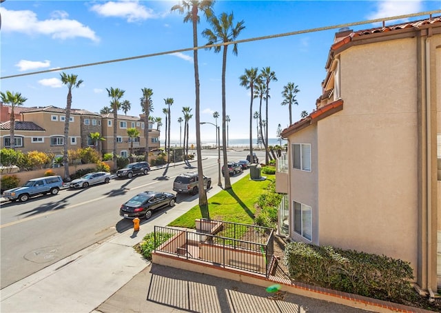 view of street featuring street lighting, a residential view, and sidewalks