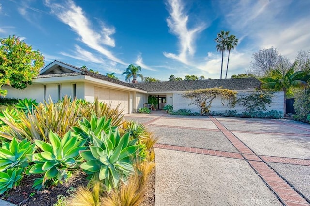 ranch-style house featuring a garage