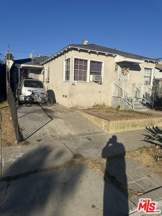 view of front of house with cooling unit