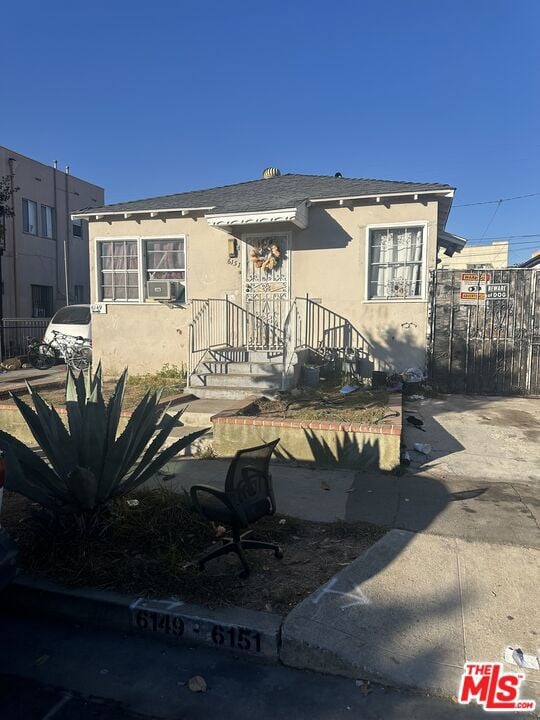 view of front of home with cooling unit