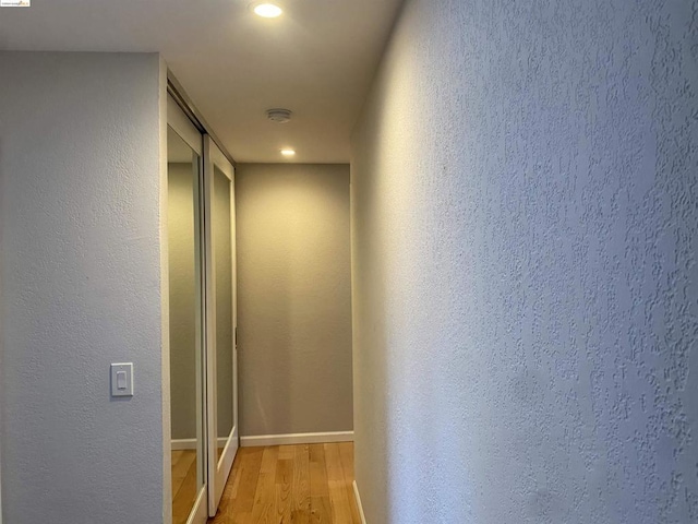 hall with light wood-type flooring