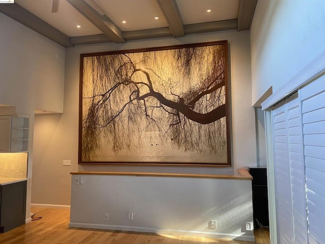 room details with beamed ceiling and hardwood / wood-style floors