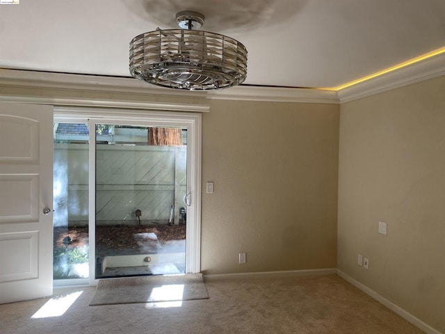 interior space featuring carpet and ornamental molding