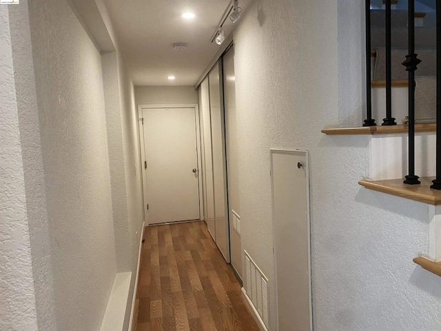 hallway with wood-type flooring