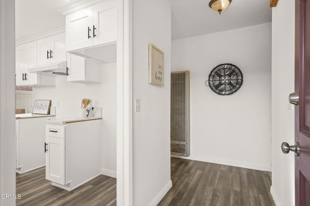 hall with dark hardwood / wood-style flooring