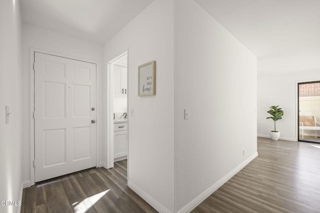 hallway featuring dark hardwood / wood-style flooring