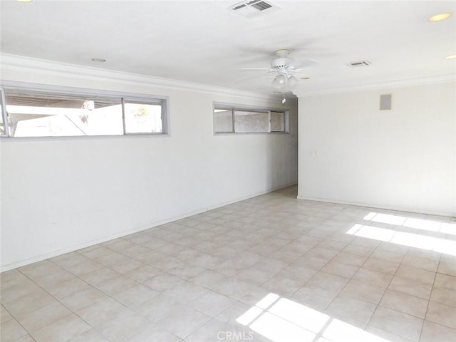 empty room featuring ceiling fan and ornamental molding