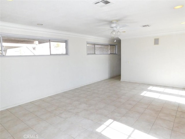 spare room featuring crown molding and ceiling fan