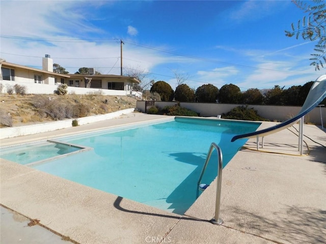 view of swimming pool featuring a water slide