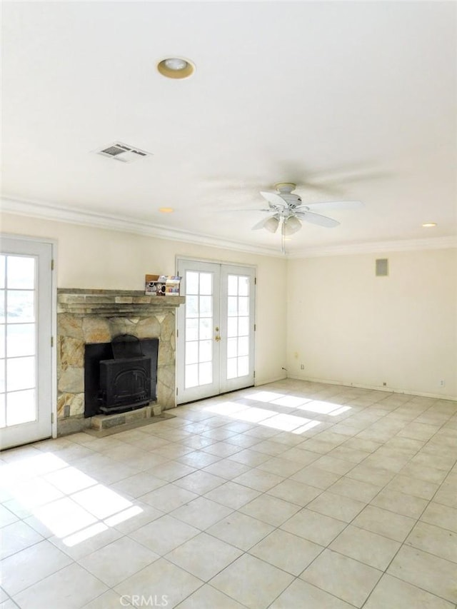 unfurnished living room with light tile patterned floors, ornamental molding, french doors, and ceiling fan