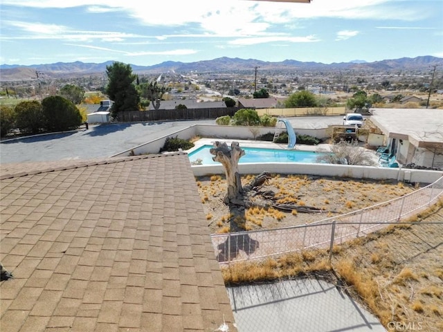 view of pool featuring a mountain view and a water slide