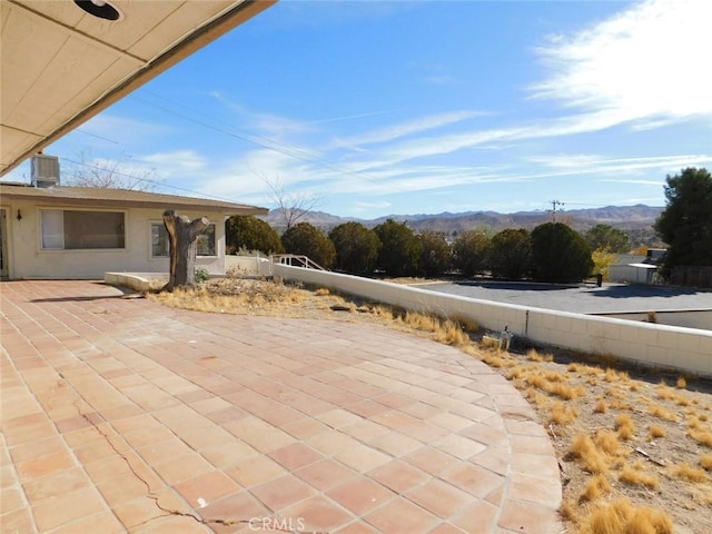 view of patio / terrace with a mountain view