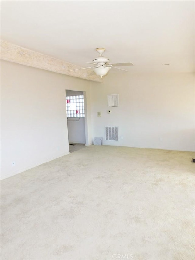 unfurnished living room with carpet floors and ceiling fan