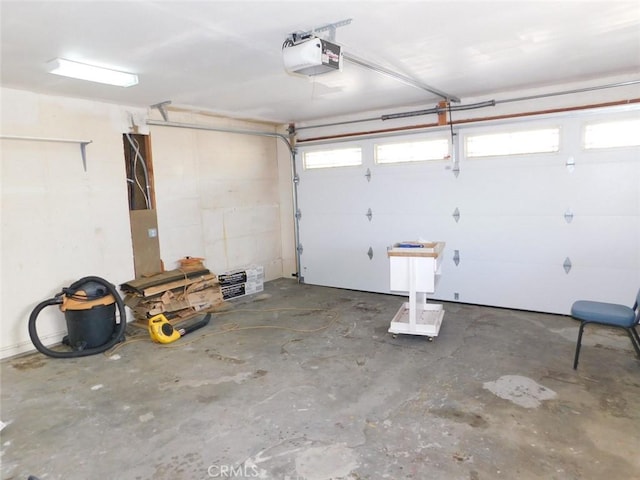 garage featuring a garage door opener