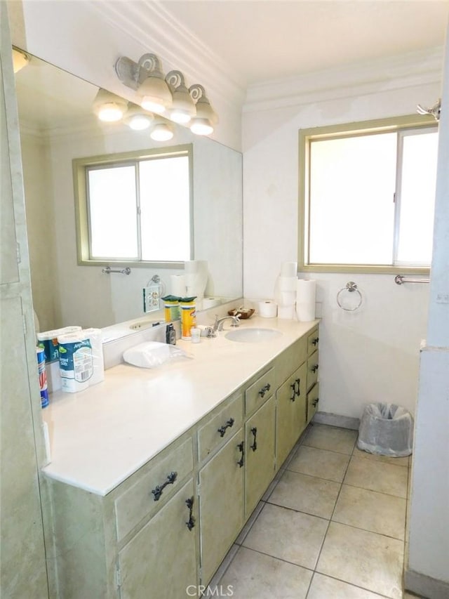 bathroom featuring crown molding, tile patterned floors, and vanity