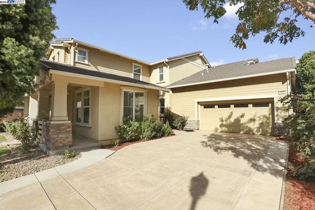 view of front of home with a garage and a porch