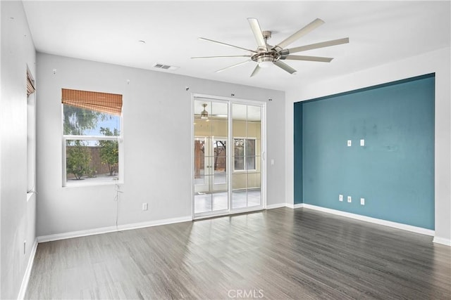 unfurnished room with hardwood / wood-style flooring and ceiling fan