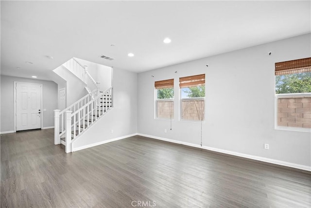 spare room featuring dark hardwood / wood-style flooring