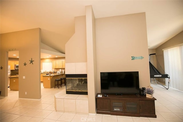 79534 Dandelion Dr, La Quinta, CA 92253 - living room with light tile patterned floors, a tile fireplace, high vaulted ceiling, and recessed lighting