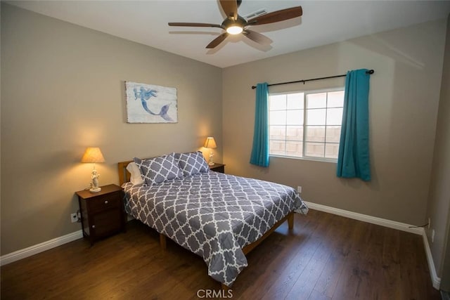 bedroom with ceiling fan and dark hardwood / wood-style floors