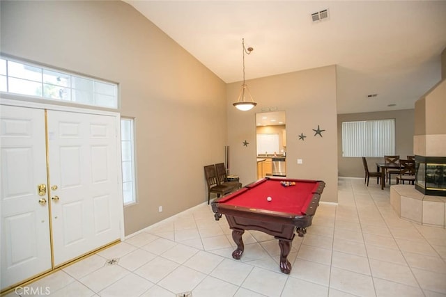 rec room with light tile patterned flooring, high vaulted ceiling, and billiards