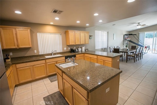 79534 Dandelion Dr, La Quinta, CA 92253 - kitchen with a sink, light tile patterned floors, light brown cabinets, recessed lighting, and an island with sink