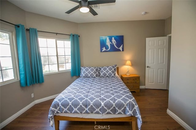 bedroom featuring dark hardwood / wood-style floors and ceiling fan