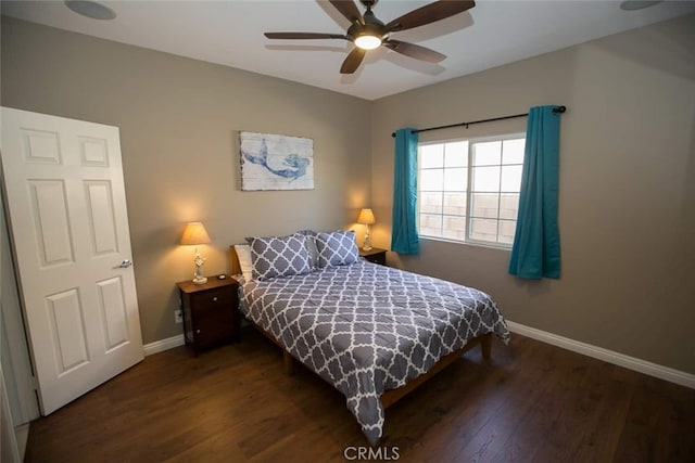 bedroom with ceiling fan and dark hardwood / wood-style flooring