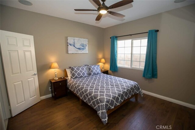 79534 Dandelion Dr, La Quinta, CA 92253 - bedroom featuring baseboards, wood finished floors, and a ceiling fan
