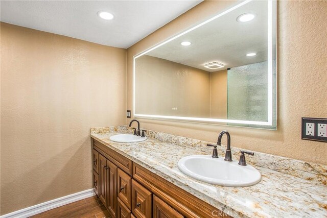 bathroom featuring vanity and hardwood / wood-style floors