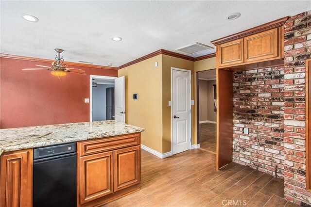 kitchen with ornamental molding, wood-type flooring, light stone countertops, and ceiling fan