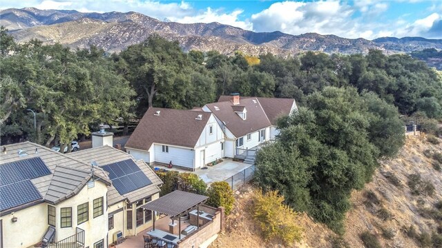 birds eye view of property featuring a mountain view