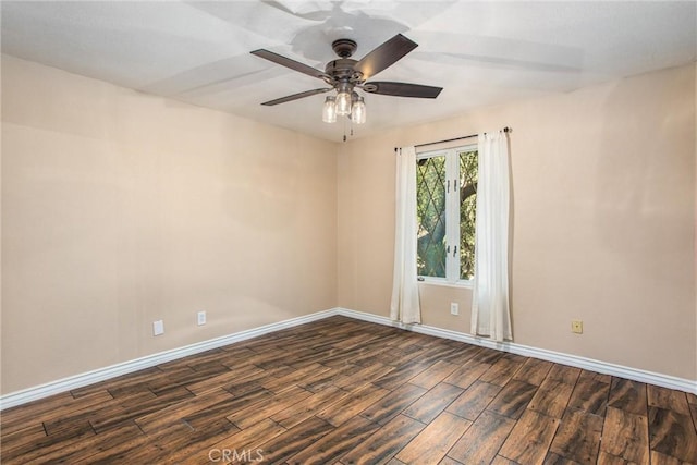 unfurnished room with ceiling fan, baseboards, and dark wood finished floors