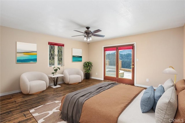 bedroom with dark hardwood / wood-style floors, access to outside, and ceiling fan