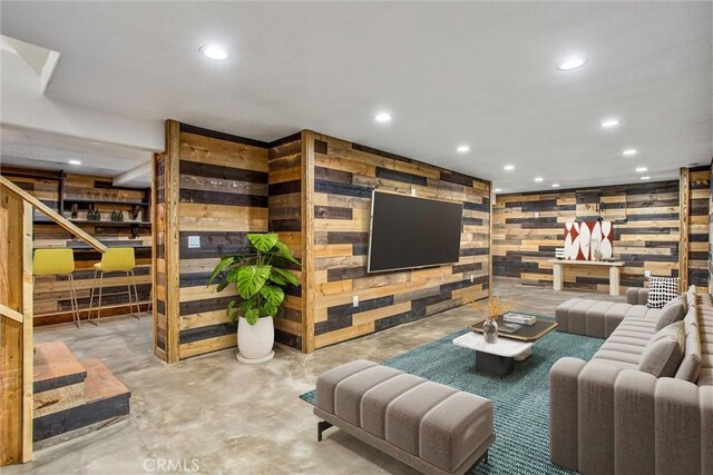 living room featuring concrete flooring and recessed lighting