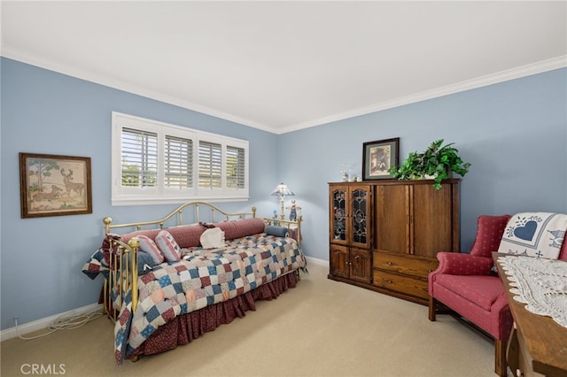 bedroom featuring crown molding and light carpet