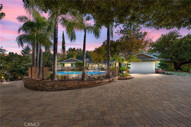 exterior space with fence and a fenced in pool