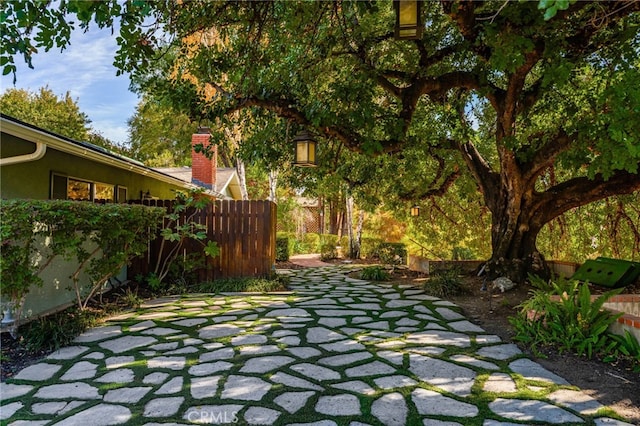 exterior space featuring a patio area and fence