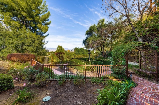 view of gate featuring fence