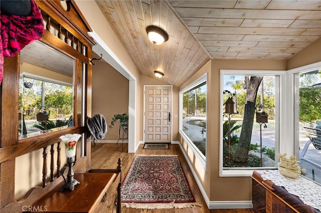 entryway with wood-type flooring, wooden ceiling, and lofted ceiling