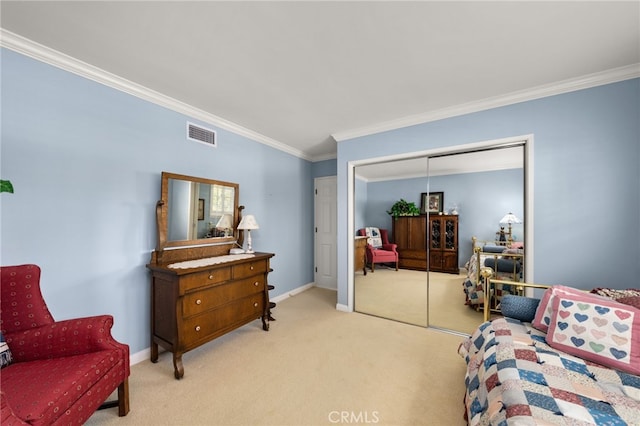 bedroom with ornamental molding, light carpet, and a closet