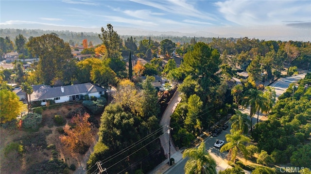 bird's eye view featuring a forest view