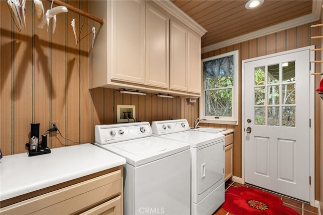 laundry room featuring sink, cabinets, wooden ceiling, washing machine and dryer, and wood walls