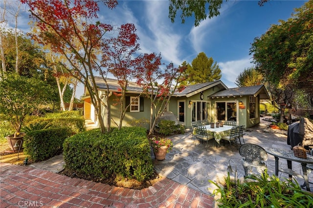 rear view of property featuring a patio