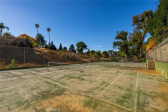 view of sport court with fence