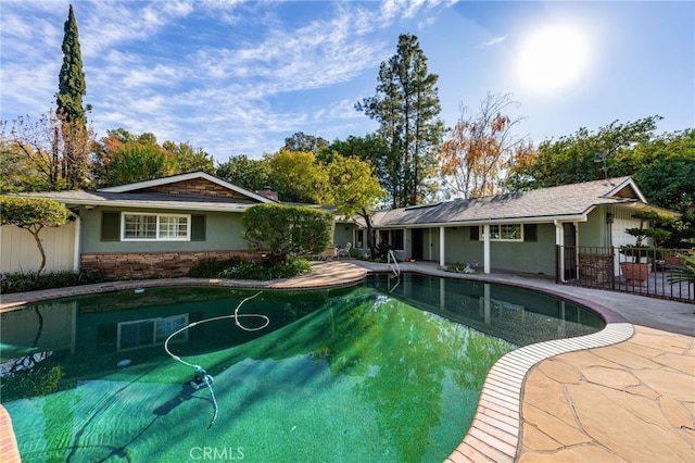 view of swimming pool with a patio