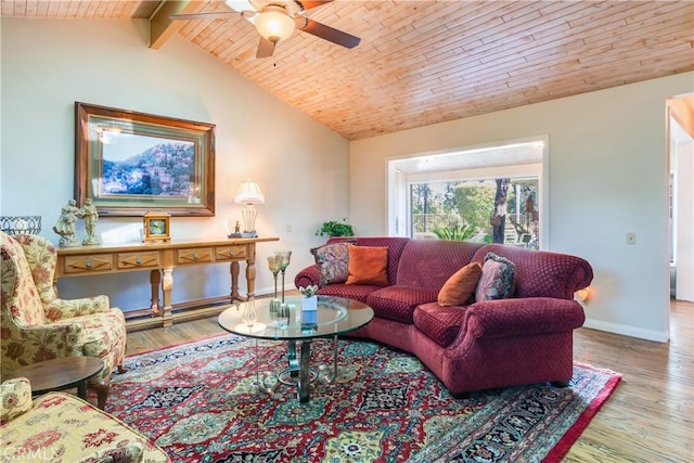living area featuring lofted ceiling with beams, wooden ceiling, a ceiling fan, and wood finished floors