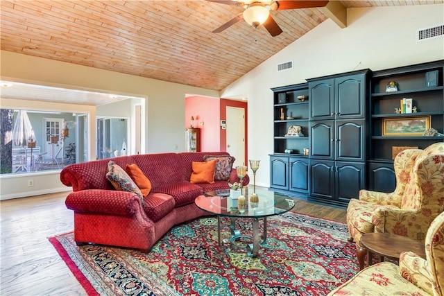 living area with ceiling fan, baseboards, wood finished floors, and visible vents