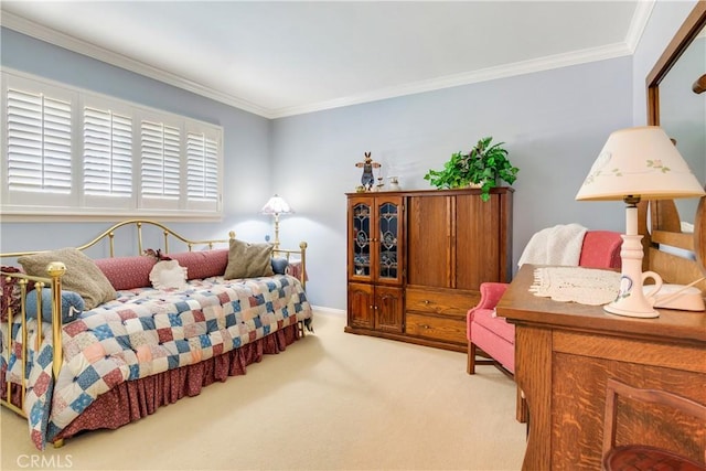 bedroom featuring crown molding and carpet