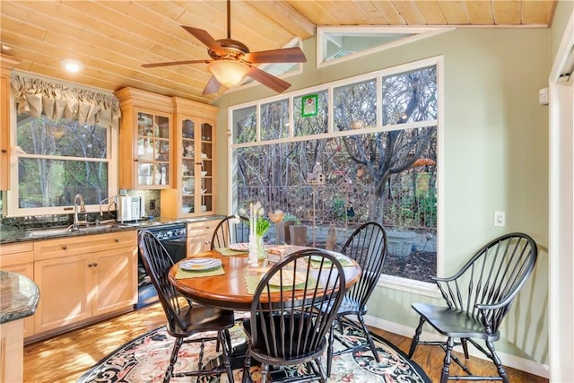 dining area featuring wooden ceiling, a ceiling fan, lofted ceiling, and light wood-style floors